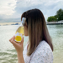 Load image into Gallery viewer, Sachi Soy Wine Yuzu and Bergamot in a beach
